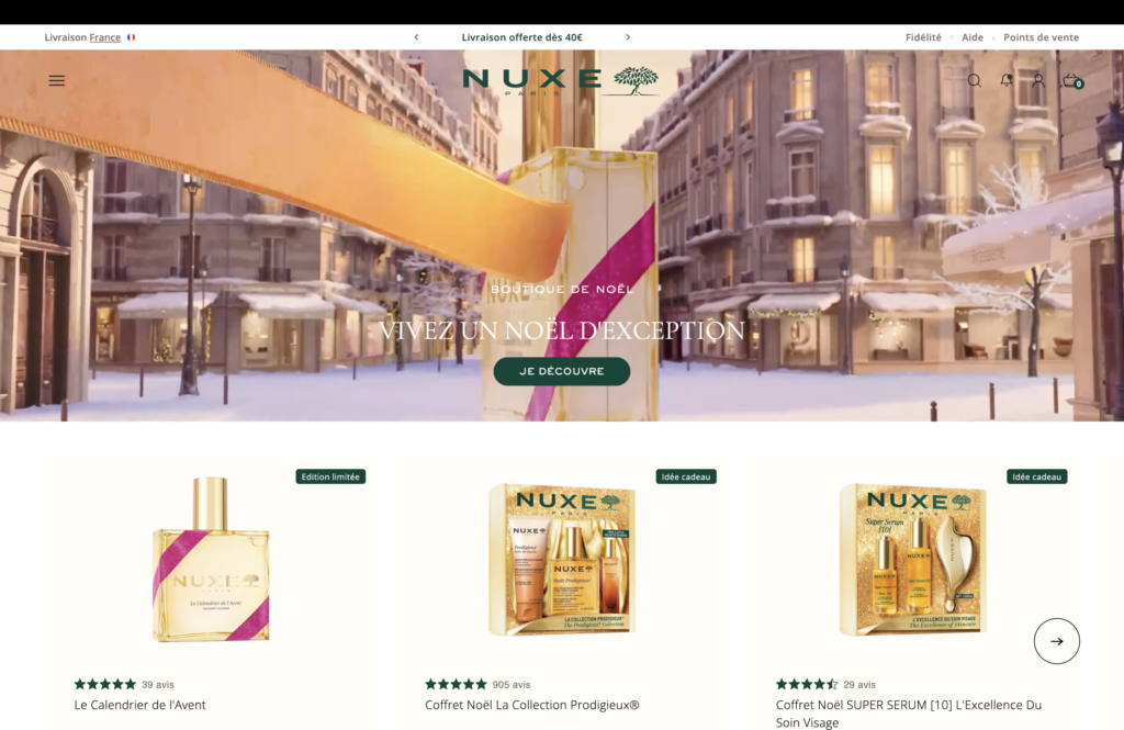 Hero de Noël du site Nuxe, texte blanc sur une rue enneigée, capture avant refonte, analyse agence Prisméa